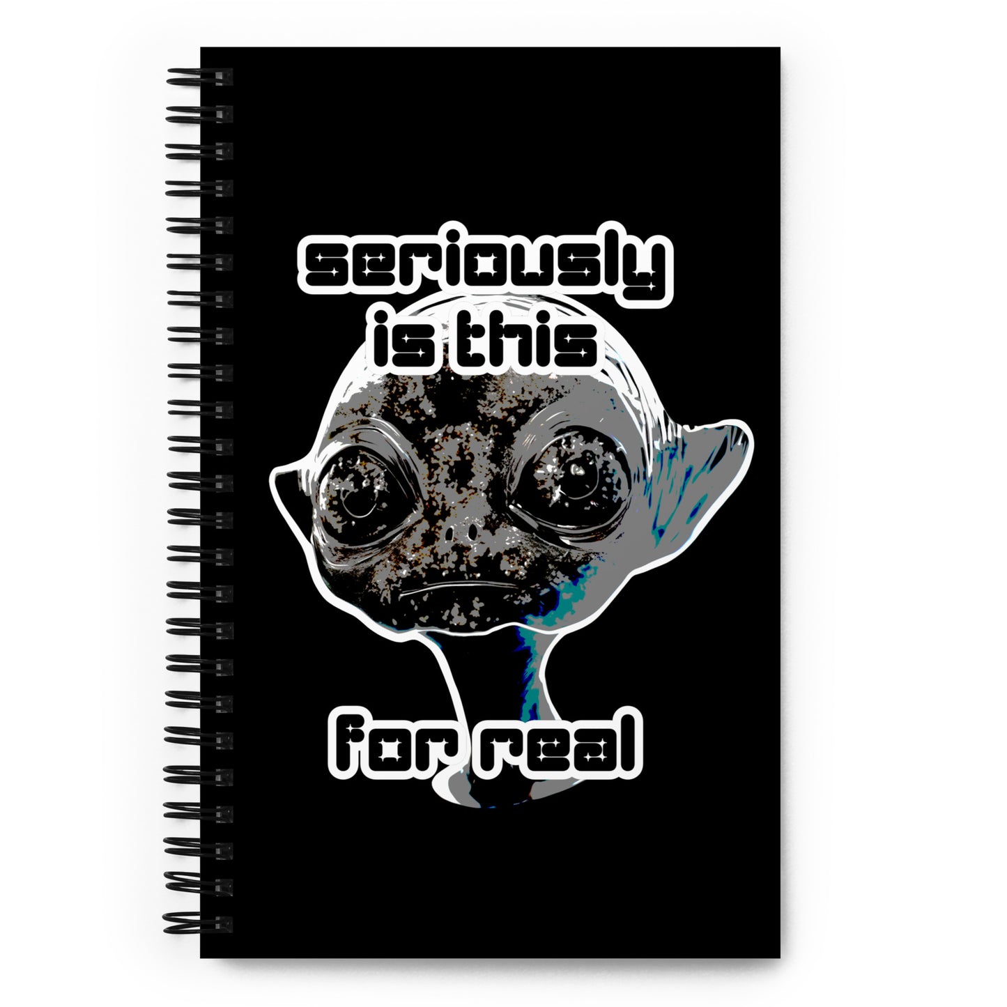 a spiral bound notebook with cover an alien and text "seriously is this for real"
