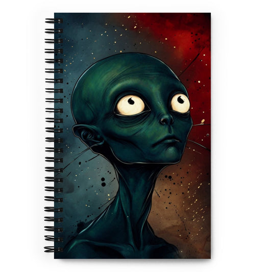 A notebook with cover illustration a contemplating alien