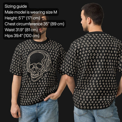 Man wearing a black short sleeve knit featuring a line art skull with headphones and hand drawn diamonds, with sizing information