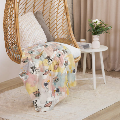 a pastel ice cream colored fleece sherpa blanket with space theme