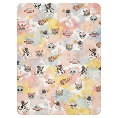 a pastel ice cream colored fleece sherpa blanket with space theme
