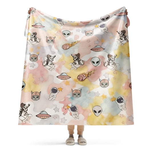 a pastel ice cream colored fleece sherpa blanket with space theme
