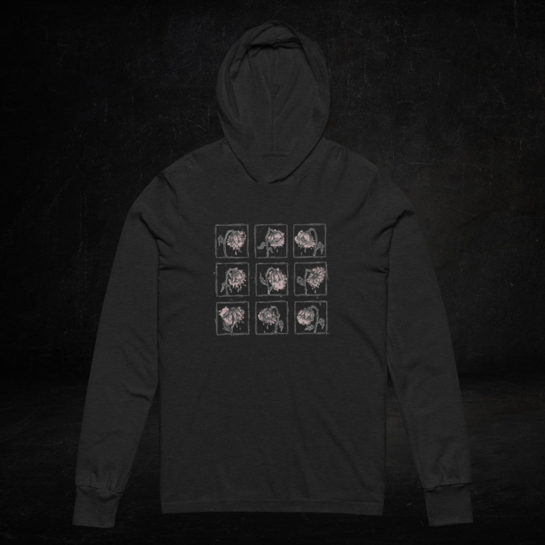 a black Hooded Long-Sleeve Bella Canvas 3512 tee with a grid of crying emo flowers in soft pink