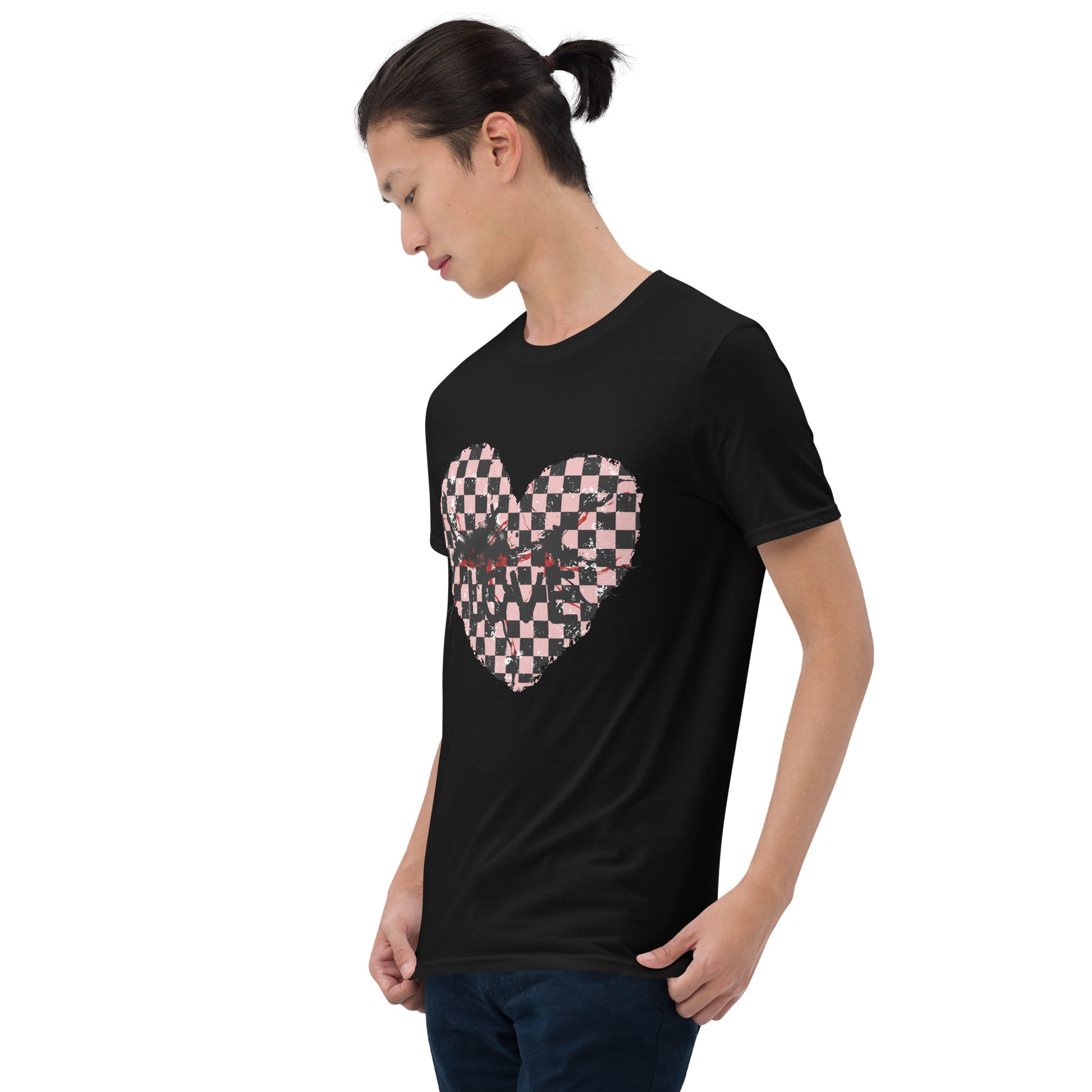 man wearing a black t-shirt with a pink and black cracked checkered heart and the text love partly obscured