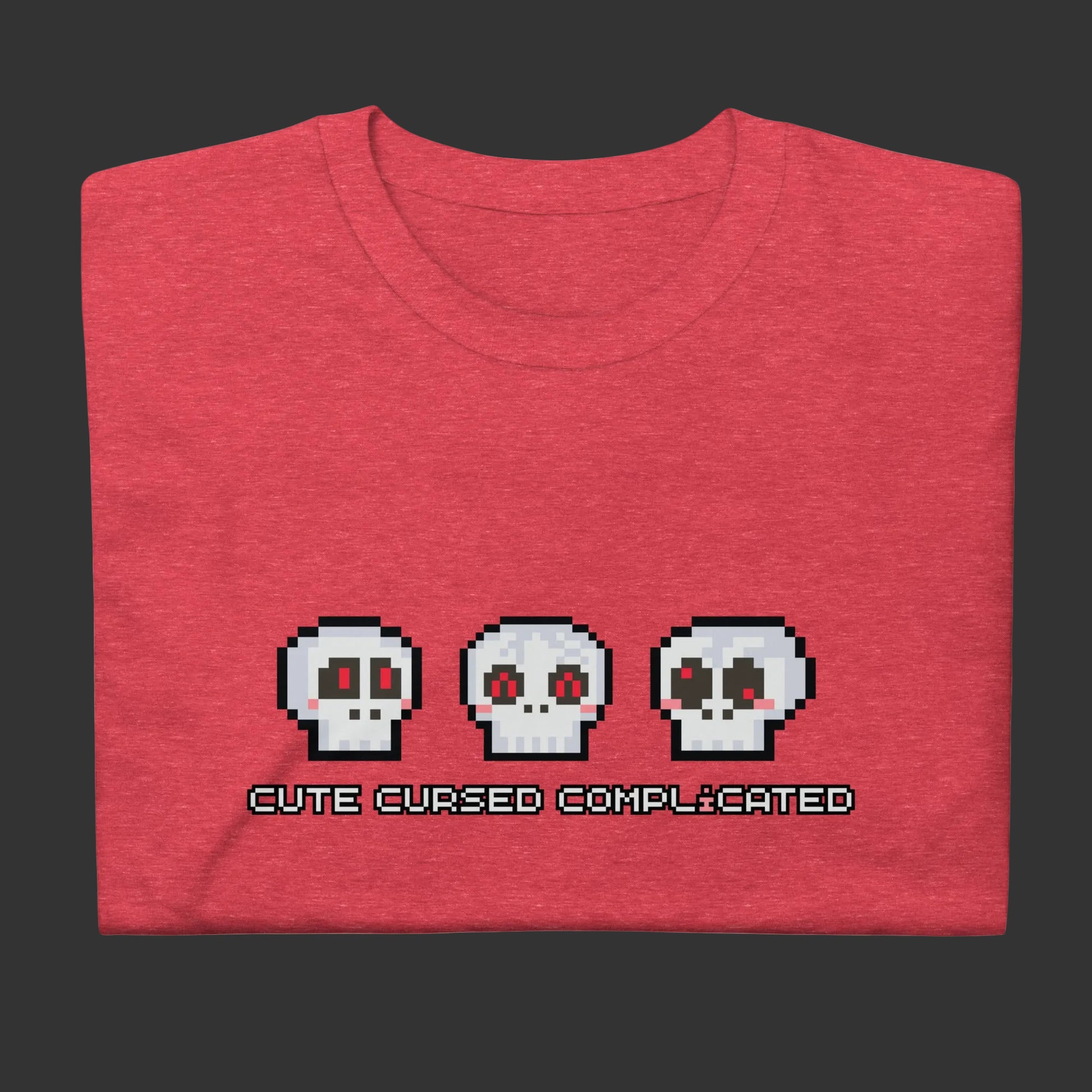A t-shirt with pixel art skulls and text "cute cursed complicated"
