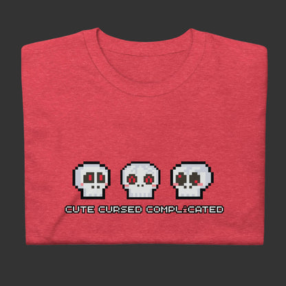 A t-shirt with pixel art skulls and text "cute cursed complicated"