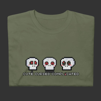 A t-shirt with pixel art skulls and text "cute cursed complicated"