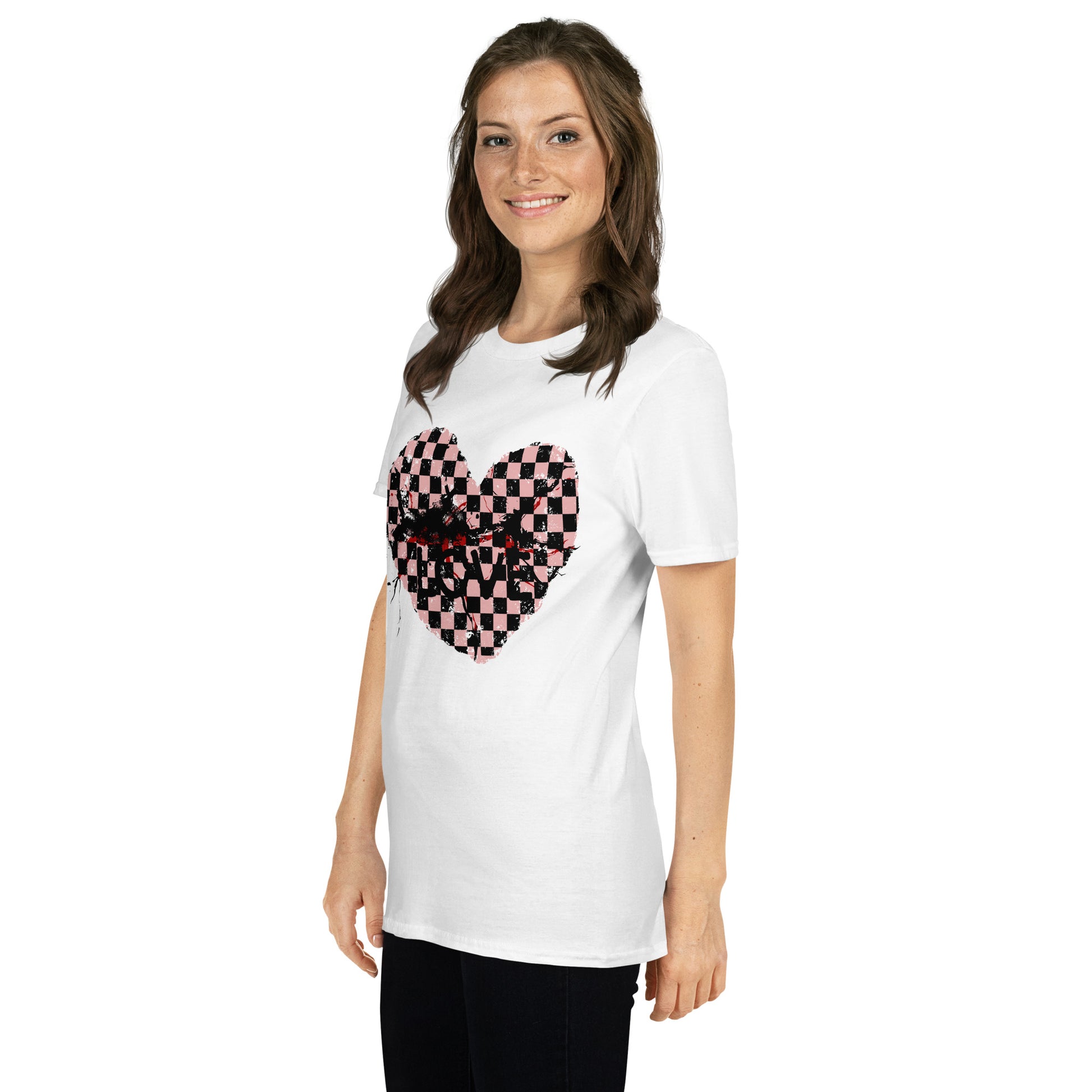woman wearing a white t-shirt with a pink and black cracked checkered heart and the text love partly obscured