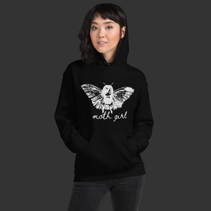 Person wearing a hoodie with a distressed pointillism design of an emo girl with moth wings and the text "moth girl"