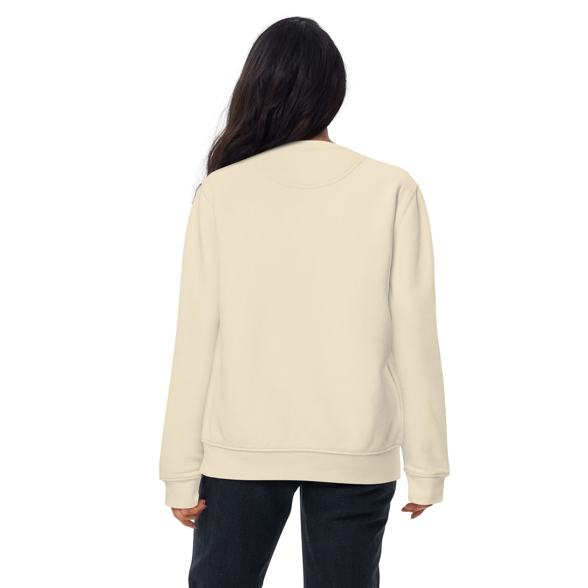 back of a woman wearing a bone white sweatshirt